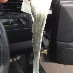 Baby wipe with grease and crap on it from the steering wheel contacts
